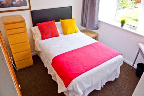 A bright and inviting double bedroom featuring ...