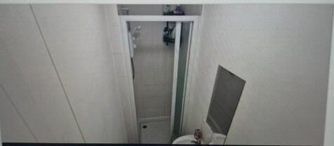 A compact and functional bathroom featuring a s...