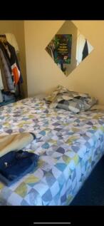 A cozy double bedroom featuring a comfortable b...