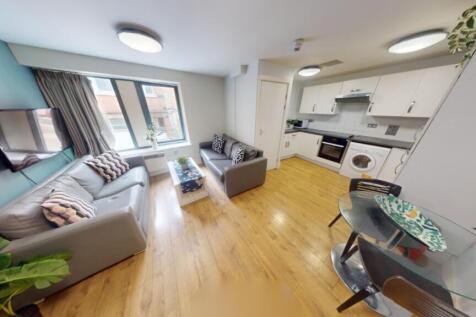 A spacious and inviting large modern living roo...