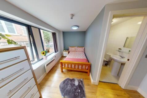 A bright and spacious double bedroom featuring ...