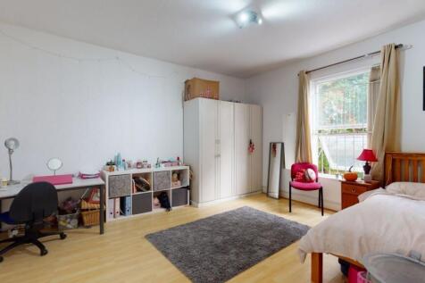 Bright and spacious master bedroom featuring a ...