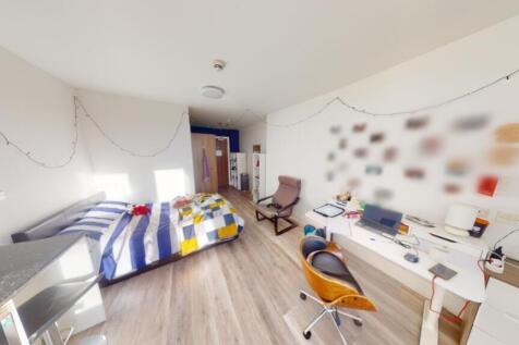Bright and spacious double bedroom featuring a ...