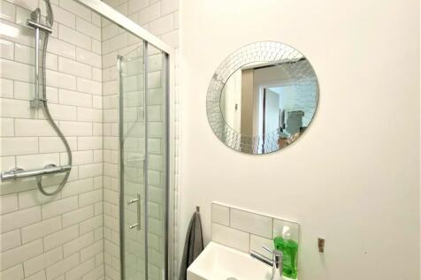 A modern and clean bathroom featuring a stylish...
