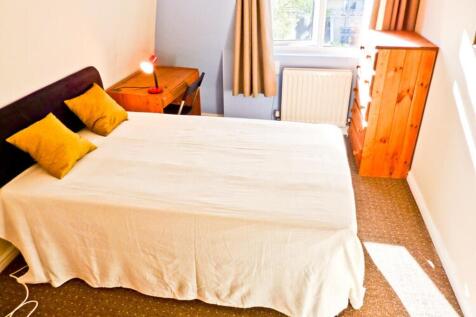 A bright and inviting double bedroom with ample...
