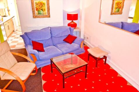 A cozy and inviting living room featuring comfo...