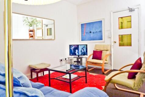 A cozy living room with comfortable seating and...