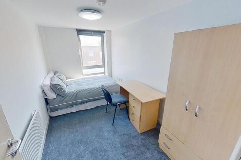 A bright and inviting double bedroom featuring ...
