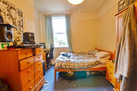 Cozy double bedroom featuring a comfortable bed...
