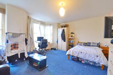 A cozy double bedroom featuring ample natural l...
