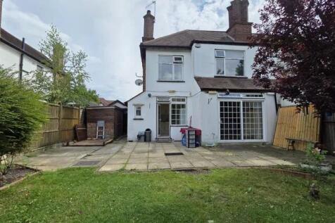 Rear view of a charming semi-detached house fea...