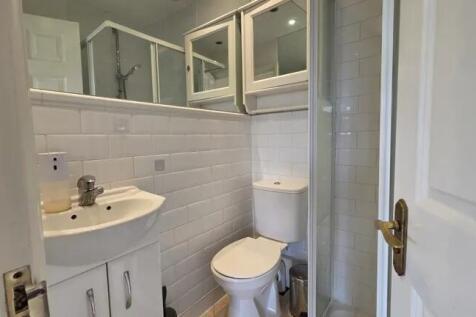 A clean and well-maintained bathroom featuring ...