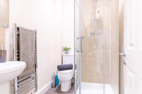 This modern bathroom features a sleek design wi...