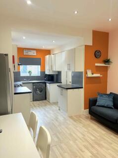 Modern and bright living room featuring a spaci...