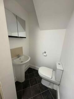 A clean, well-maintained bathroom featuring a t...