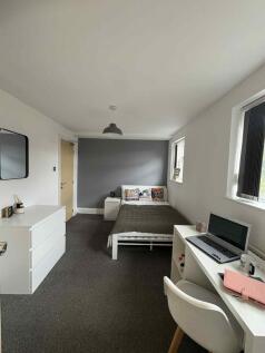 A welcoming bedroom featuring a comfortable dou...