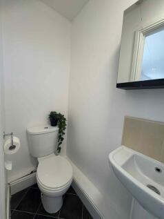 A clean, well-maintained bathroom featuring a t...