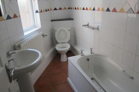 Bright and spacious bathroom featuring a modern...