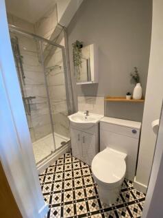 A beautifully designed bathroom featuring moder...
