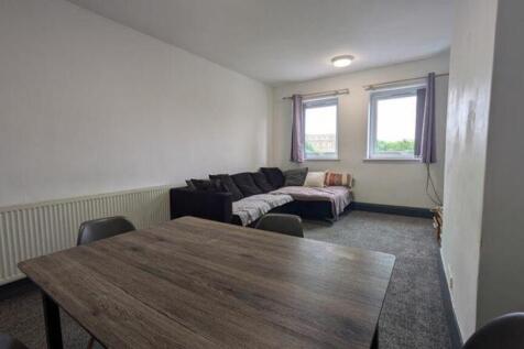 A spacious and inviting modern living room, per...