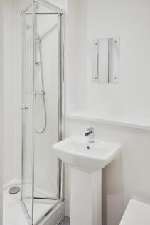 A modern and clean bathroom featuring a stylish...