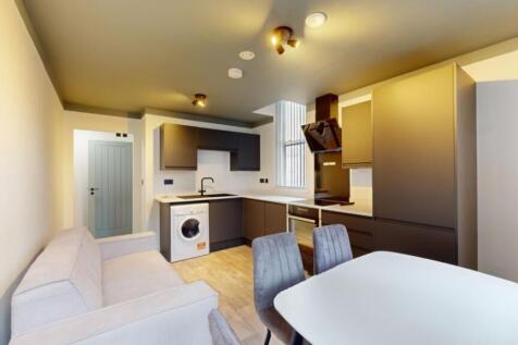 A modern and clean kitchenette featuring stylis...