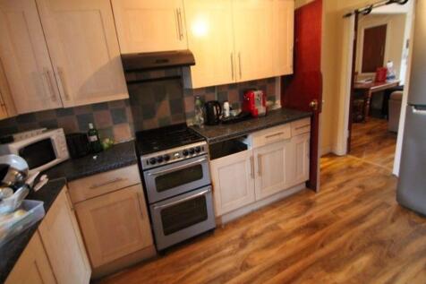 Bright and tidy kitchen with functional applian...