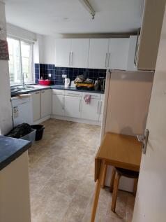 Spacious kitchen with ample storage and natural...