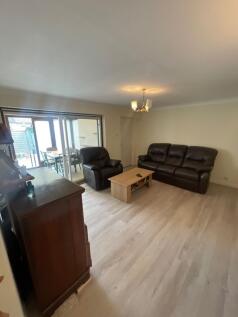 A spacious and inviting living room featuring c...