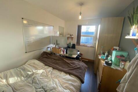 A cozy double bedroom featuring ample natural l...