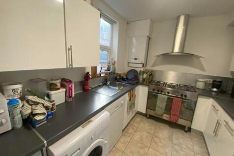 A well-equipped kitchen with ample storage, nat...