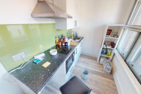 A modern kitchen featuring a sleek design with ...