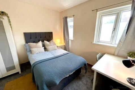 A cozy double bedroom featuring stylish decor, ...