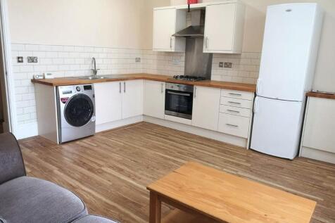 Bright and modern kitchen with ample countertop...