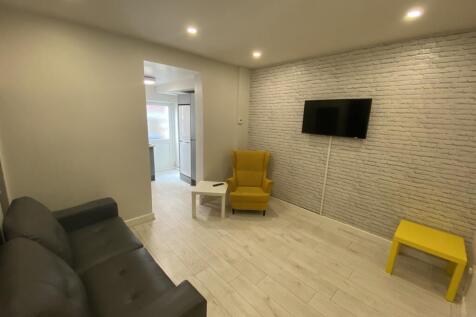 A modern living room featuring a cozy seating a...