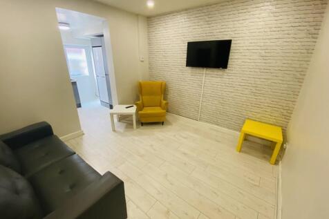A stylish living room featuring a comfortable b...