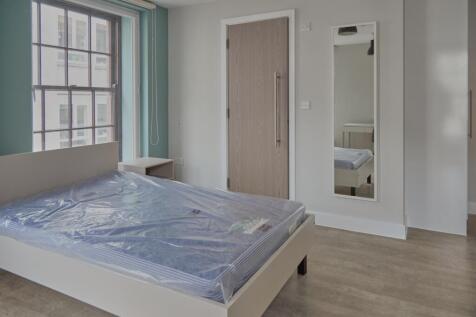 A spacious and inviting double bedroom featurin...