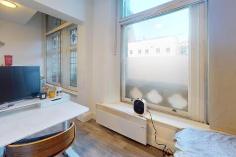 This inviting communal workspace features large...