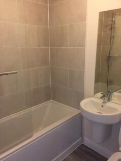 A modern and clean bathroom featuring a relaxin...