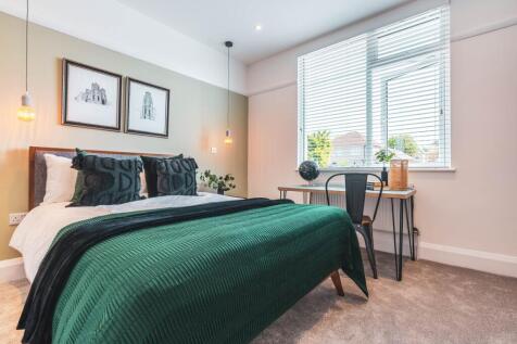 A beautifully designed large double bedroom fea...