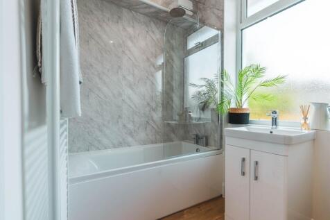 A beautifully designed bathroom featuring a mod...
