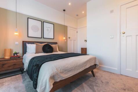 A stylish and inviting double bedroom, featurin...