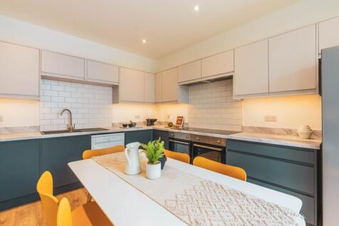 A modern and stylish kitchen with ample space, ...