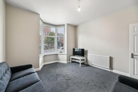 A bright and inviting living room featuring a l...