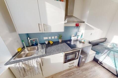 Stylish kitchenette with modern appliances, amp...