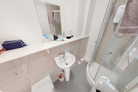 Bright and modern bathroom featuring a sleek sh...