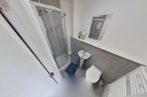 Modern bathroom featuring a sleek shower, styli...