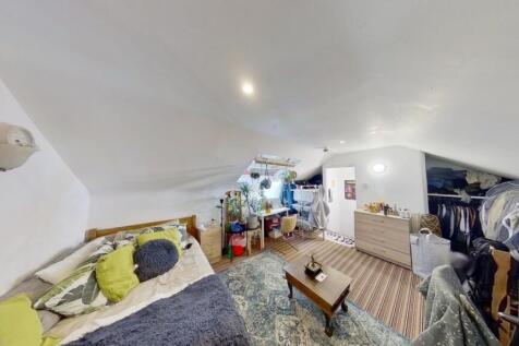 A cozy and well-furnished living room featuring...