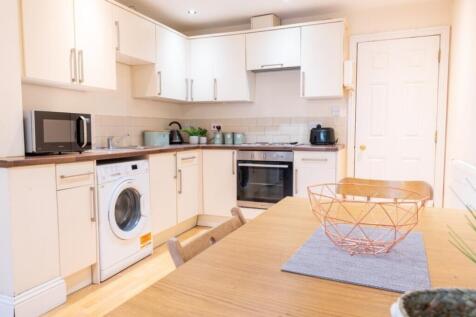 This beautifully designed kitchen features mode...