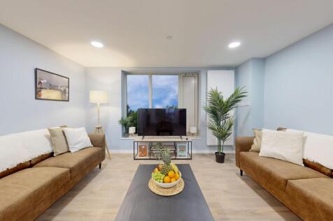 A bright and inviting living room featuring mod...
